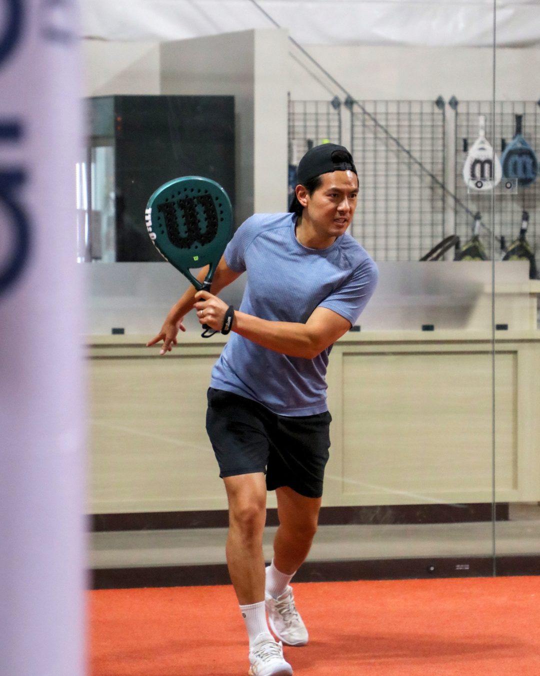 A player lining up a forehand at Arenna Denver Padel